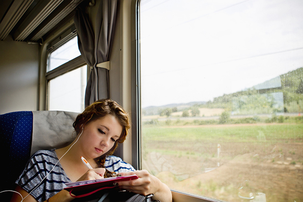 A Young Woman Riding In A Train