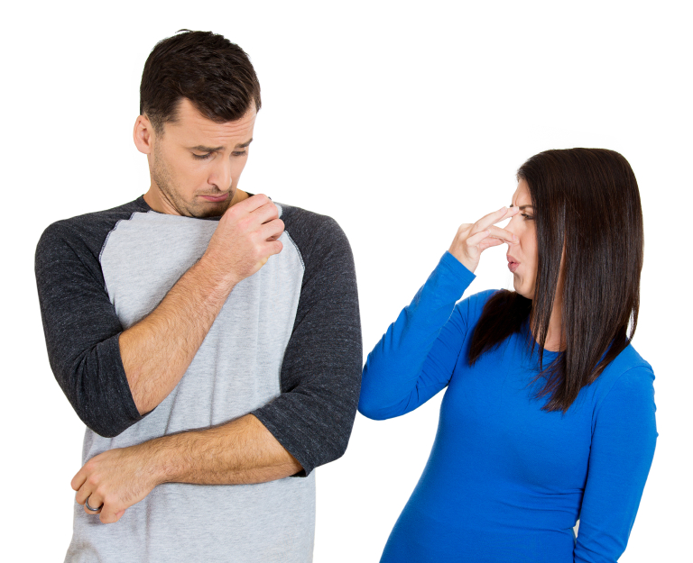woman covering nose because the man stinks
